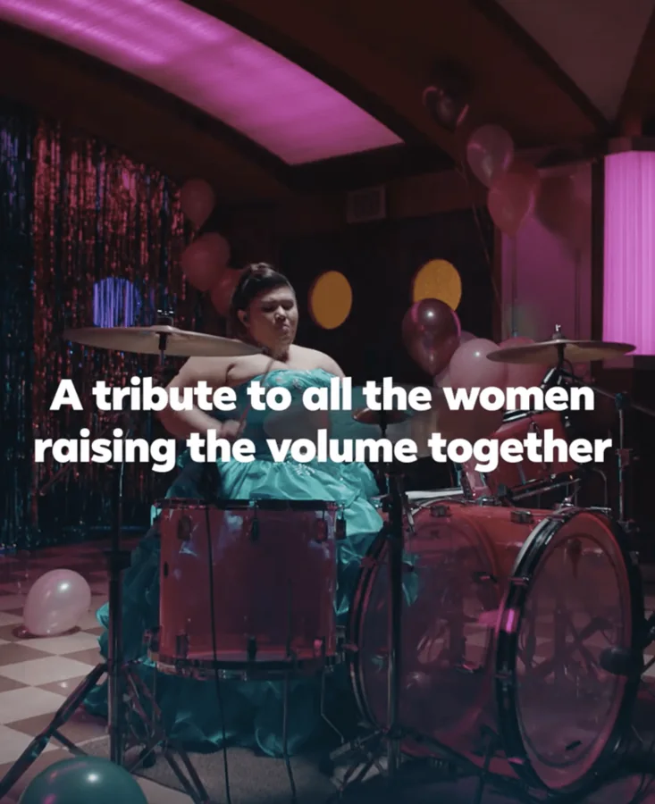 Sharon at her kit in a Facebook commercial: A tribute to all the women raising the volume together